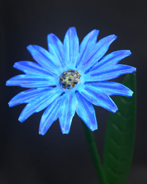 Close-up of handcrafted blue metal daisy flower sculpture by NK Creations